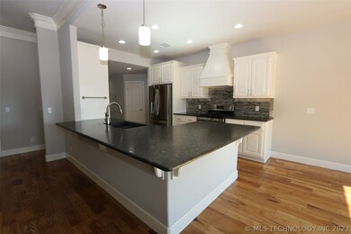 Open concept kitchen with chiseled granite, stainl