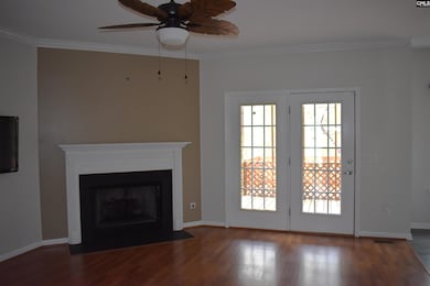 Living room with view of french doors leading to t