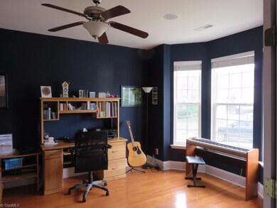 French doors lead to the bay window office.  surround sound is located  throughout the home.