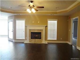 Large open great room with center fireplace and ha