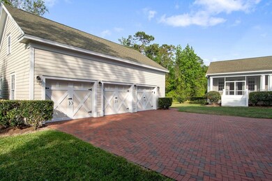 Oversized 3-car detached garage with accent doors