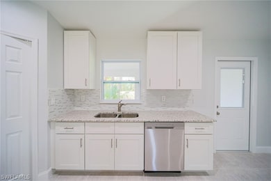The Kitchen Has Real White Wood Cabinetry With Sof