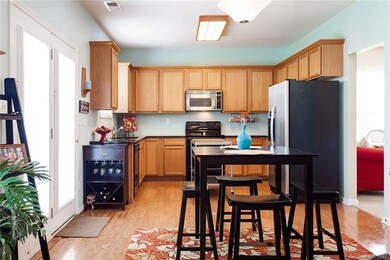 Gourmet kitchen with GRANITE and laminate wood flo