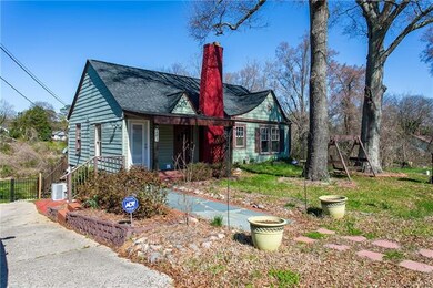 Concrete drive, side-load garage, and a huge, alum