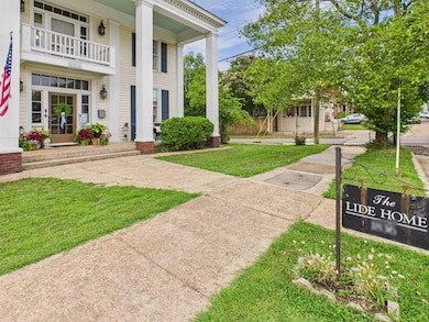 FRONT OF HOME WITH SIGN