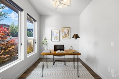 Office space featuring wood finished floors and plenty of natural light