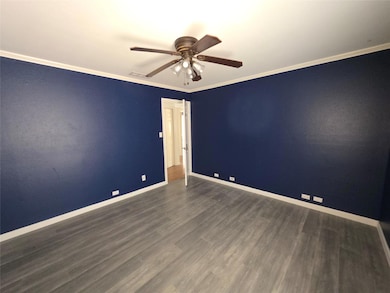 Spare room with wood finished floors, visible vent