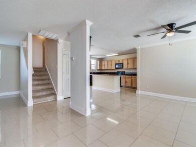 Unfurnished living room with a textured ceiling, c