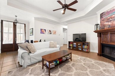 Living Area - tile flooring; ceiling fan; tray cei