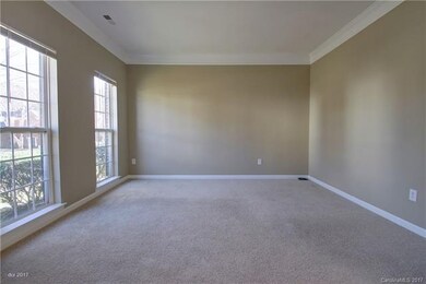LIVING ROOM: The formal living room is located on 
