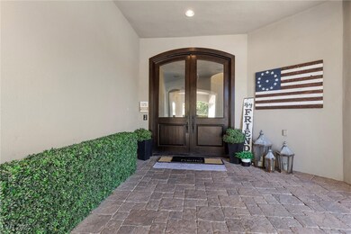 View of exterior entry featuring stucco siding and