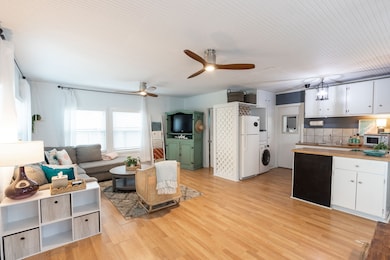 A light/bright, open-concept living area with lami