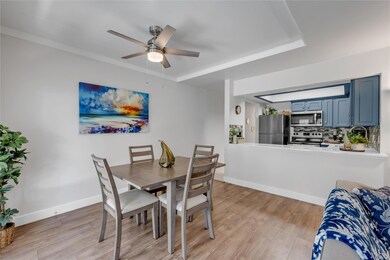 Dining space featuring ceiling fan, light wood-ty