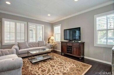 Living room w/ crown moldings, designer distressed
