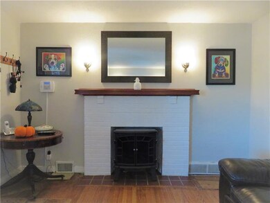 Original hardwood flooring in living room.
