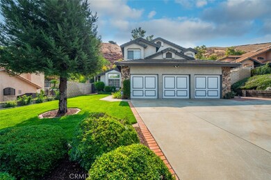 Front of home, ample parking with this 3 car garage and RV possible along the side of the driveway