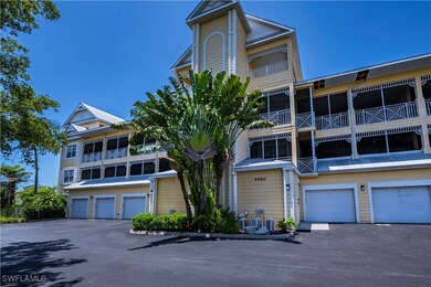 View of front of house featuring a garage and a ba