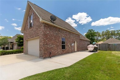 Side entrance to garage and extended driveway