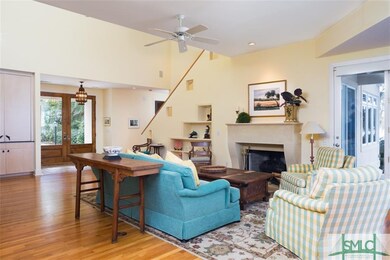 A beautifully molded fireplace mantle and adjacent