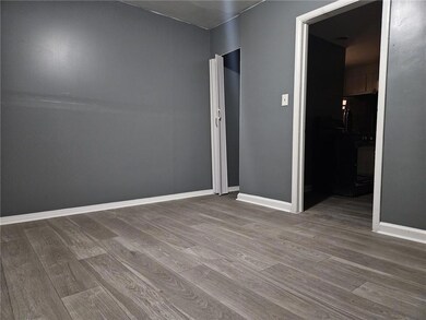 Unfurnished room featuring wood finished floors an