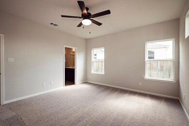 Unfurnished room featuring a ceiling fan, carpet 