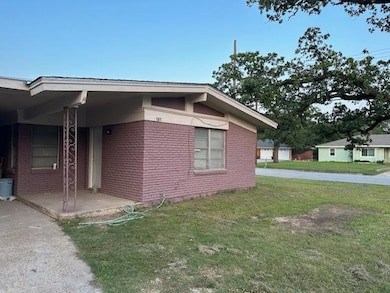 View of side of property with brick siding and a y