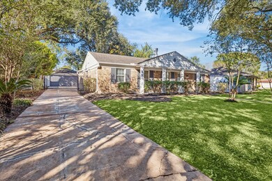 Mature trees and landscaping, Automatic driveway gate on light traffic street.