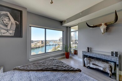 Bedroom featuring wood finished floors, a water v