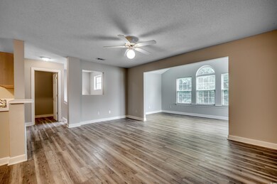 Unfurnished room featuring plenty of natural light