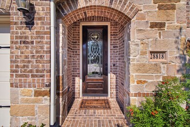All brick design covered Porch leads up to the ric