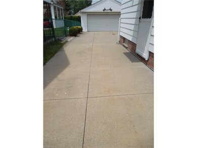 Spacious 2 car garage with extra driveway parking.