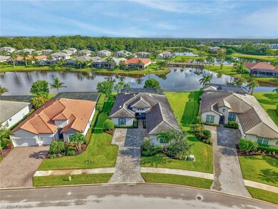 Aerial view of residential area featuring a nearby body of water