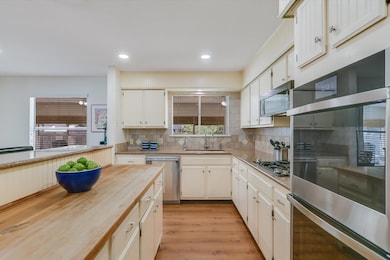 Kitchen featuring stainless steel appliances, a s