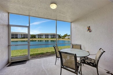 Sunroom / solarium featuring a water view