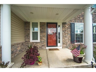 Large front porch perfect for chairs or a bench.