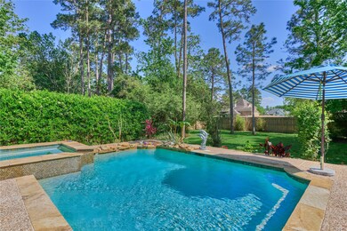 The property features a shimmering pool and spa, s