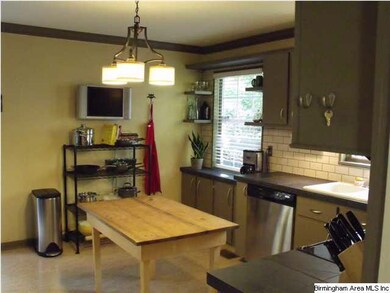 Stainless appliances with beautiful cabinets.