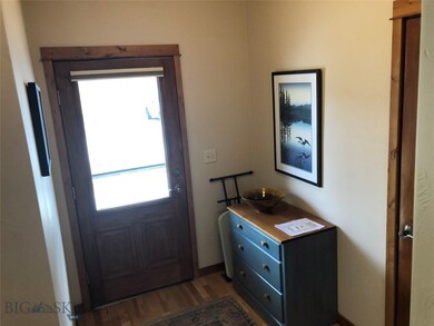 Entrance foyer with dark wood-type flooring