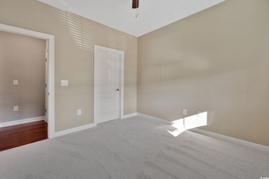 Unfurnished bedroom featuring new carpet, paint an