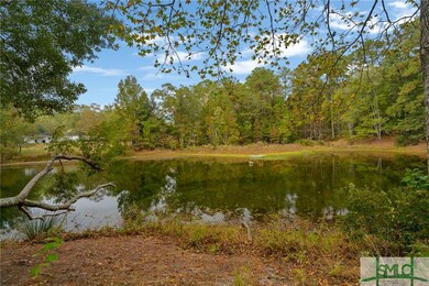 In front of the house, looking across the pond.