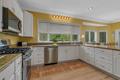 Large lookout window and ample cabinetry for all your culinary needs.