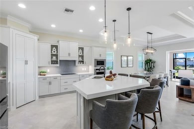 Kitchen with stainless steel appliances, light cou