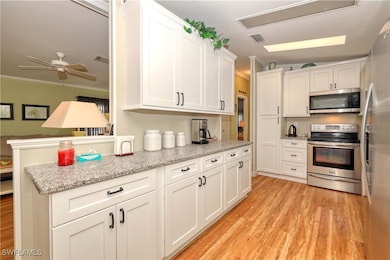 Kitchen with stainless steel appliances, ceiling f