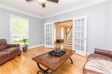 This view shows the double french doors and hardwo