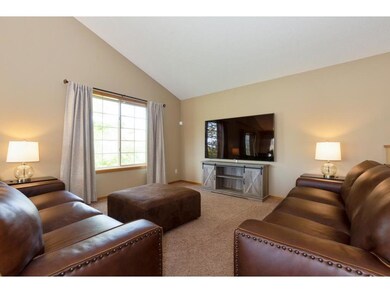 The living room is bright and airy with its vaulte