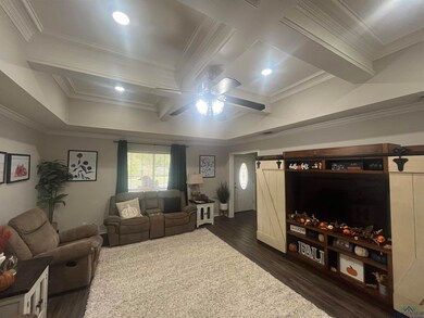Living area with coffered ceiling, ornamental mold