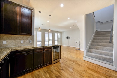 A stylish tile backsplash adds a touch of sophisti