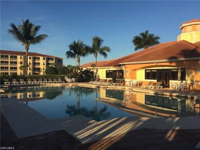 Community pool featuring a patio