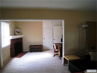 Den/3rd bedroom... with fireplace, closet and shel