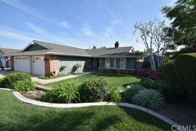 Front of home showing lawn areas and landscaping